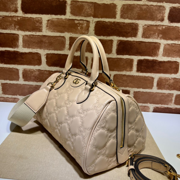 G*u*i gg matelassé leather top handle bag