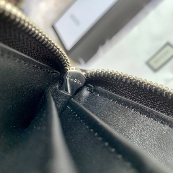 G*u*i leather zip around wallet