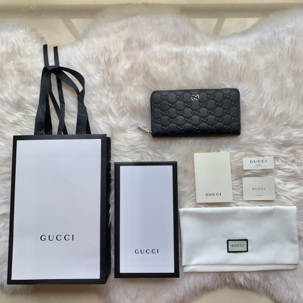 G*u*i leather zip around wallet