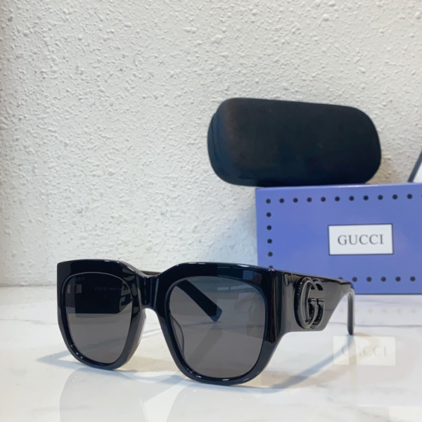 G*u*i sunglasses